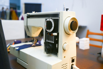 Fototapeta na wymiar White sewing-machine in a tailor´s atelier