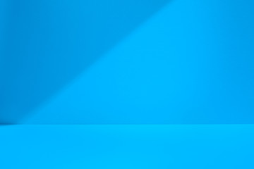 Blue studio space with shadow