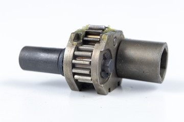 Wheels for mechanical gears on a white workshop table. Mechanical parts for mechanical devices.