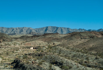 A tunnel is visible in the desert mountains of eastern Arizona