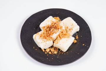 Dumplings with cottage cheese (traditional polish dish called lazy pierogi/ leniwe pierogi) fried with bread crumbs 