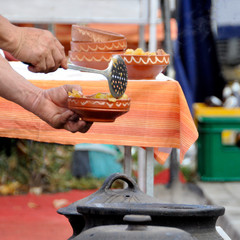 man imposes cooked food cooked according to ancient recipes.