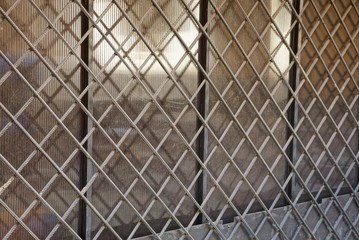 texture of gray metal grill on plastic wall