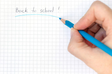 Back to school, hand drawing with colorful blue pencil, top view