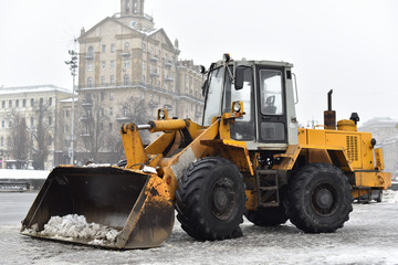 bulldozer for snow removal on a winter street