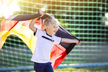 Tuinposter Germany football fan kids. Children play soccer. © famveldman