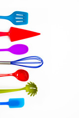 Different kitchen utensils tools for cooking isolated on white.