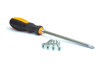 Screwdriver and screws isolated on a white background closeup