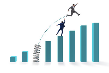 Businessman outperforming his competition jumping over
