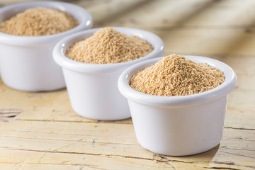 amaranth beans in bowl, on rustic wooden background