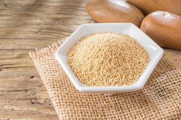 amaranth beans in bowl, on rustic wooden background
