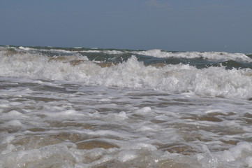waves breaking on shore of the sea