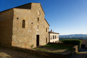 Fototapeta na wymiar Facade of the old Romanesque church Pieve di San Pietro a Gropina. Loro Ciuffena, Tuscany, Italy.
