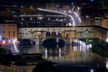 Fototapeta na wymiar Night view of the Old Bridge, Ponte Vecchio, and the Arno river in Florence, Italy.