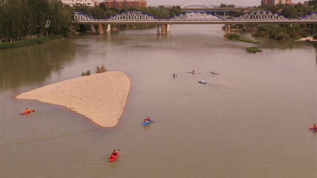 Kayaks padling on the Ebro river in Zaragoza, Aragon, Spain &ndash; wide