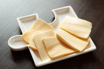 Sliced fresh cheese, close-up
