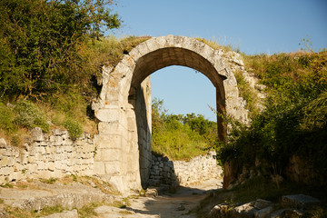 Fototapeta na wymiar Old stone arch on the peninsula of Crimea