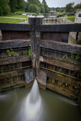 Water seeping through gates at lock on canal