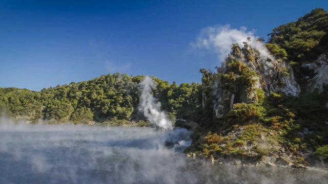 Timelapse video of smoke coming out from the hot water and hills in Waimangu Volcanic Valley, New Zealand.
