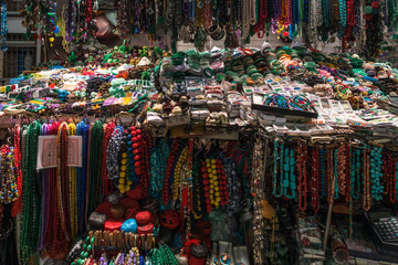 A stall selling necklaces and bracelets at Hong Kong Jade market
