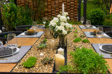 Luxury banquet dining table settings decoration serving with dishes, glass, napkins for celebration