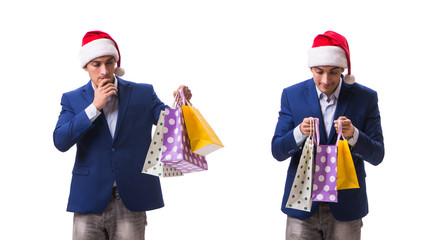 Young man with bags after christmas shopping on white background