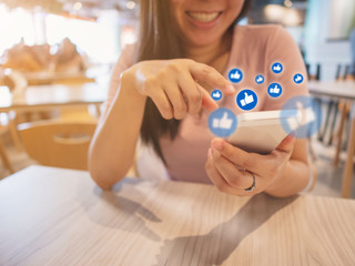 Social network sharing and commenting in the online community, Woman hand holding smartphone and using application social media