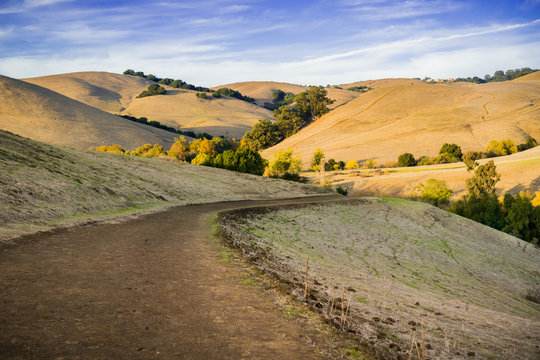 Hiking Trail Through Golden Hills At Sunset In Garin Dry Creek Pioneer Regional Park, East San Francisco Bay, California