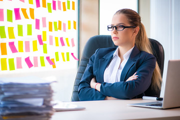 Beautiful female employee with many conflicting priorities 