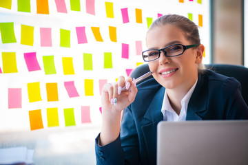 Beautiful female employee with many conflicting priorities 