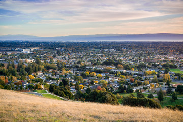 View towards Fremont and Union City from Garin Dry Creek Pioneer Regional Park on a sunny autumn evening, San Francisco bay, California