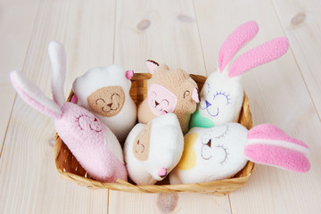 several cute handmade toys in a basket