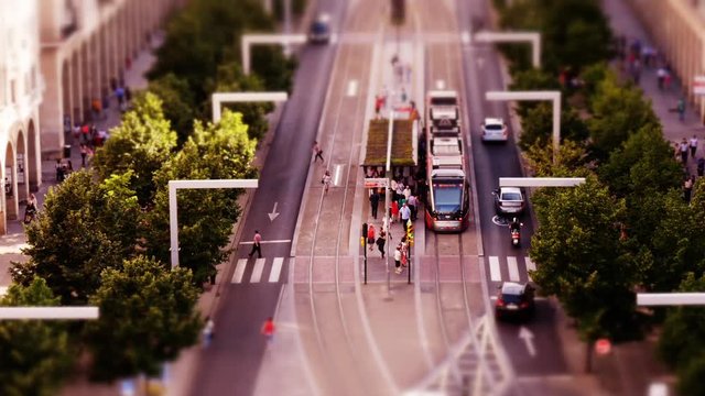 Tilt-shift: Miniature city center Zaragoza with trams seen from above. Aragon, Spain