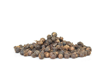 black peppercorns heap top view on white background.