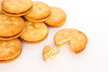 Crackers broken in half top view on white background.