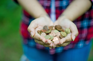 Female hand holding coin And happy with the savings. And copy space