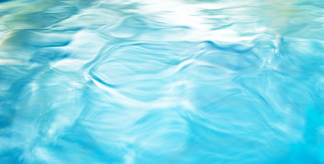 The smooth natural blue water background with bokeh  abstract on the sea or ocean,vintage and soft colored blur.