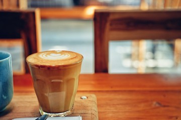 cup of coffee on wooden table