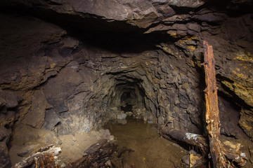 Underground abandoned gold iron ore mine shaft tunnel gallery passage