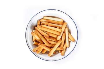 bread sticks top view on bowl on white background.