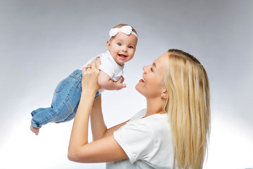 beautiful young mother with toddler baby girl