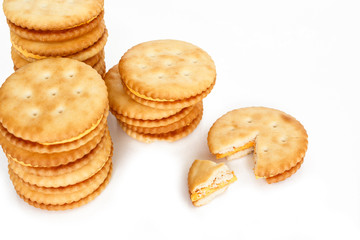 Crackers broken in half top view on white background.
