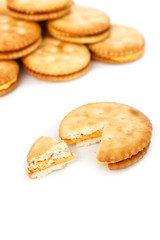 Crackers broken in half top view on white background.
