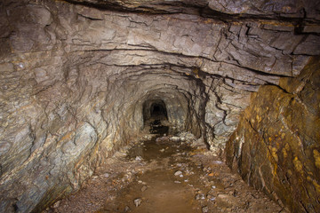 Underground abandoned gold iron ore mine shaft tunnel gallery passage