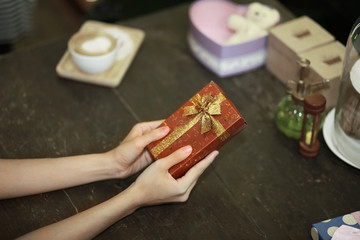lady hand hold present or gift box with wondering and surprise