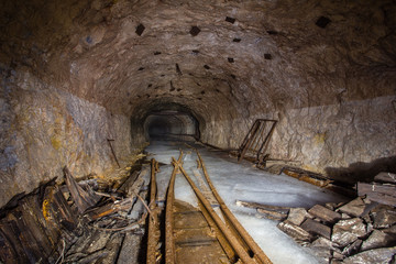 Fototapeta na wymiar Underground abandoned gold iron ore mine shaft tunnel gallery passage