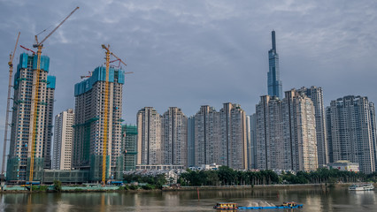 Skyscrapers in Ho Chi Minh City Vietnam. View from the river bank.