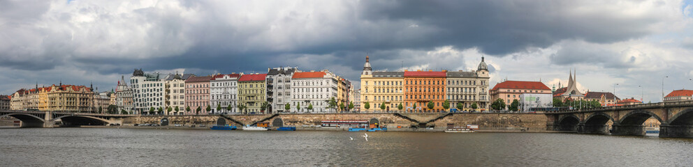 view of the Vltava Embankment and the dancing house in Prague, Czech Republic