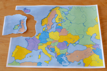 Torn paper map symbolizing the UK leaving the European Union or Brexit