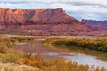 Fototapeta na wymiar Colorado River and Fisher Towers Cloudy Day